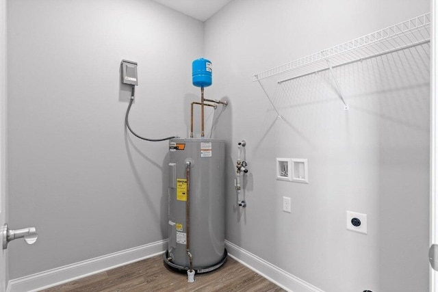 utility room with electric water heater