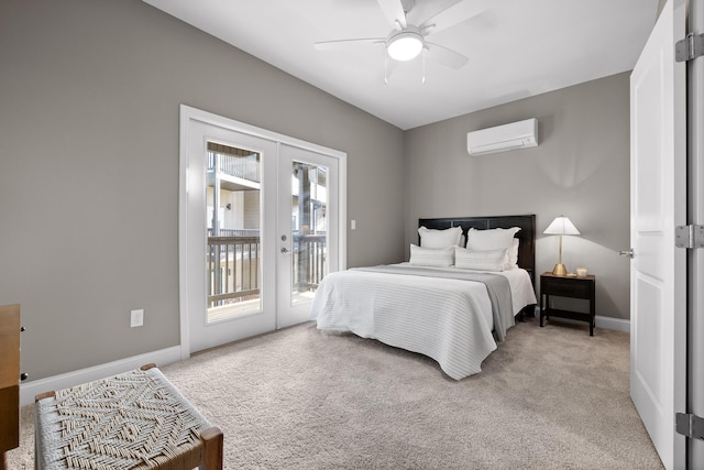 bedroom featuring access to exterior, carpet, french doors, a wall mounted air conditioner, and baseboards