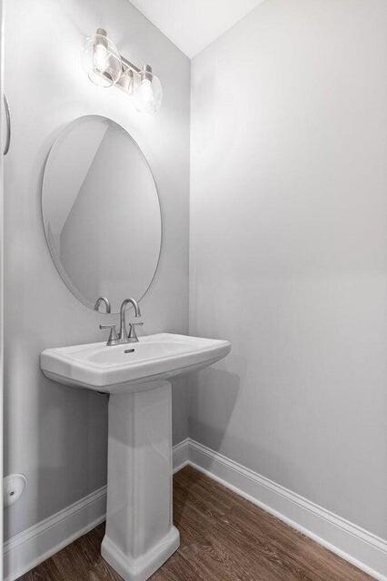 bathroom featuring sink and hardwood / wood-style floors