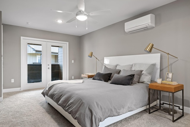 carpeted bedroom featuring french doors, a wall unit AC, a ceiling fan, access to outside, and baseboards