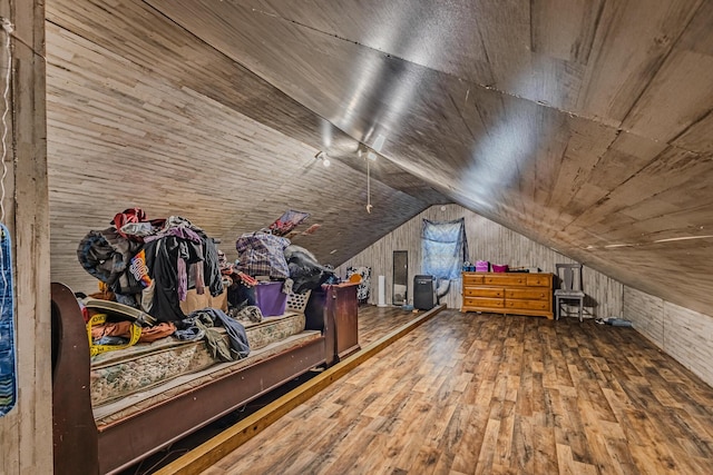 interior space featuring lofted ceiling, wood finished floors, and wood ceiling