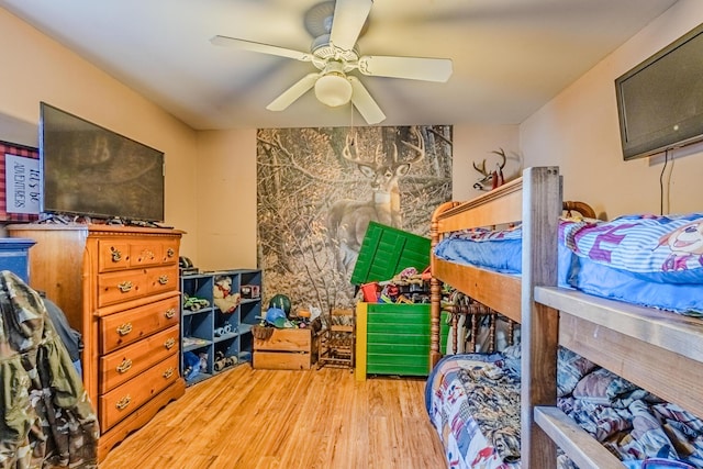 bedroom with ceiling fan and wood finished floors