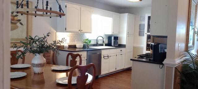 1164 Harvest Glen Dr NW, Cleveland, TN 37312 - kitchen featuring dishwasher, dark countertops, a sink, white cabinetry, and tasteful backsplash