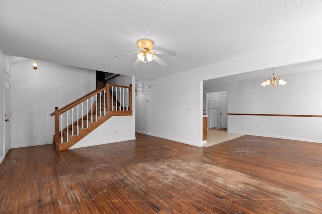 unfurnished living room with hardwood / wood-style flooring, a textured ceiling, and ceiling fan with notable chandelier