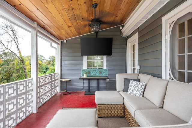 exterior space featuring outdoor lounge area and ceiling fan