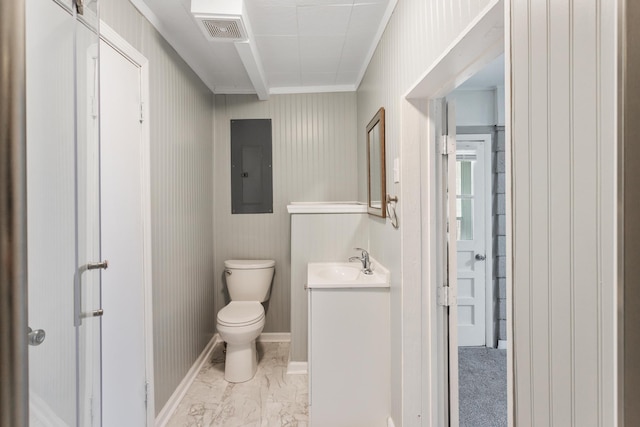 bathroom with vanity, toilet, and electric panel