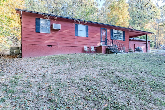 view of front of property with cooling unit and a front lawn