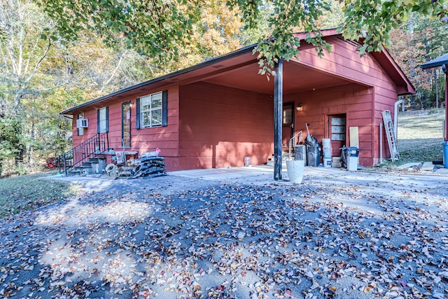 view of home's exterior featuring a carport