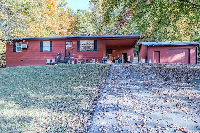 single story home featuring a front lawn, a garage, and a carport