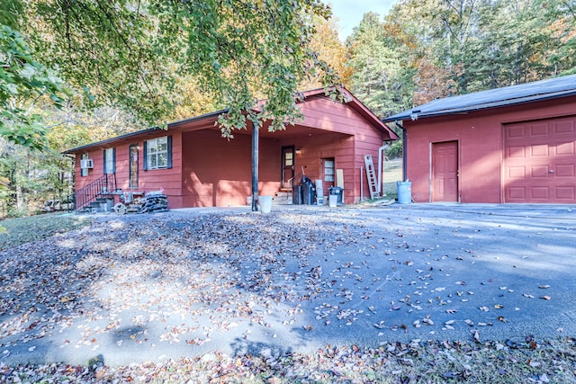 view of front of property featuring a carport