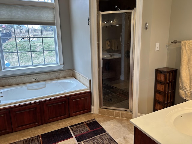 bathroom featuring vanity, tile patterned floors, and independent shower and bath