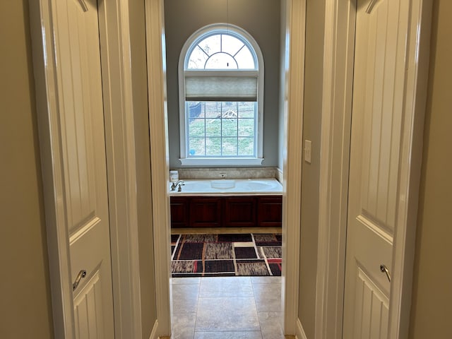 corridor with tile patterned flooring