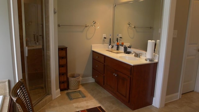 bathroom featuring vanity, tile patterned floors, and a shower with shower door