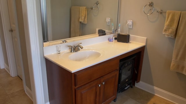 bathroom with tile patterned floors and vanity