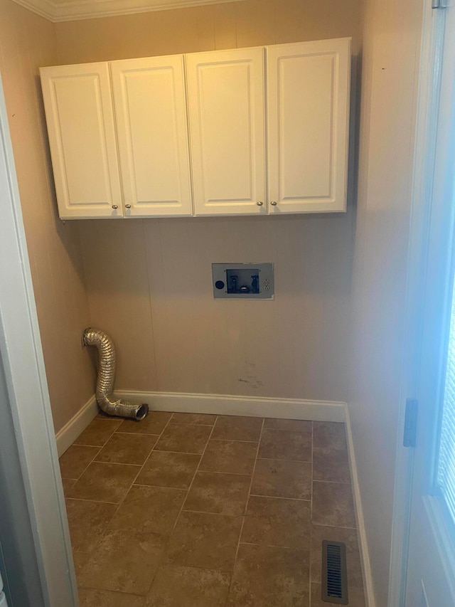 clothes washing area with hookup for an electric dryer, cabinets, ornamental molding, and washer hookup