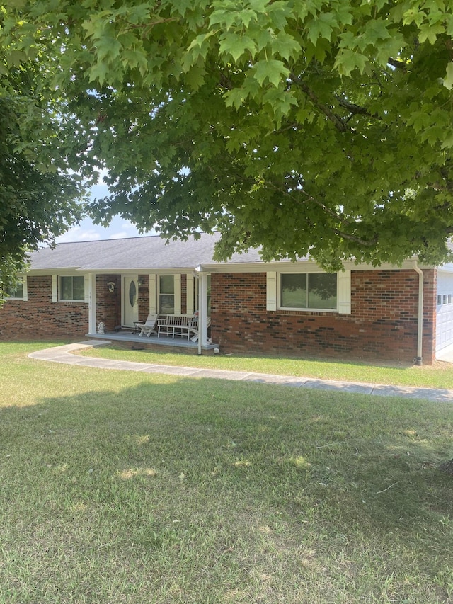 view of front of house featuring a front lawn and a porch