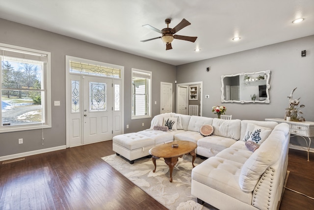 living room with dark hardwood / wood-style floors and ceiling fan