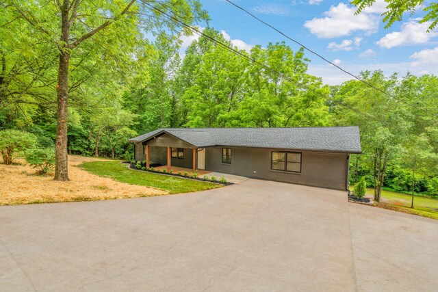 826 Long Mill Rd, Athens, TN 37303 - view of front of property with driveway, a front yard, a wooded view, and covered porch