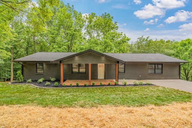 826 Long Mill Rd, Athens, TN 37303 - view of front of home with brick siding, a front lawn, covered porch, and a shingled roof