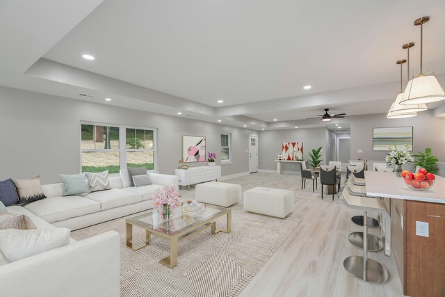 826 Long Mill Rd, Athens, TN 37303 - living room with light wood-type flooring, a tray ceiling, recessed lighting, baseboards, and a ceiling fan