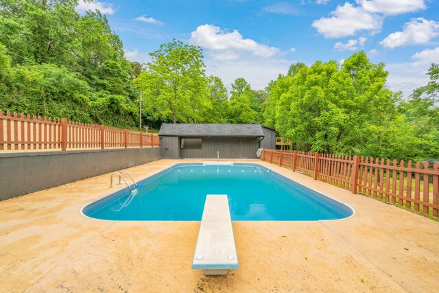 826 Long Mill Rd, Athens, TN 37303 - view of pool with a diving board, a fenced backyard, a patio area, and an outdoor structure