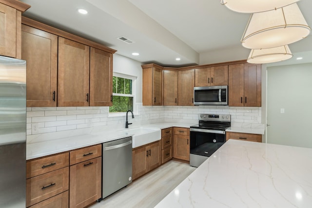 826 Long Mill Rd, Athens, TN 37303 - kitchen with stainless steel appliances, a sink, light wood-type flooring, decorative backsplash, and recessed lighting