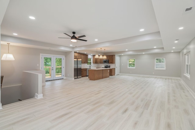 826 Long Mill Rd, Athens, TN 37303 - unfurnished living room with baseboards, light wood-style flooring, recessed lighting, french doors, and a ceiling fan