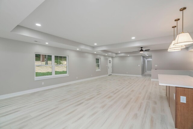 826 Long Mill Rd, Athens, TN 37303 - unfurnished living room featuring recessed lighting, light wood finished floors, a raised ceiling, baseboards, and ceiling fan