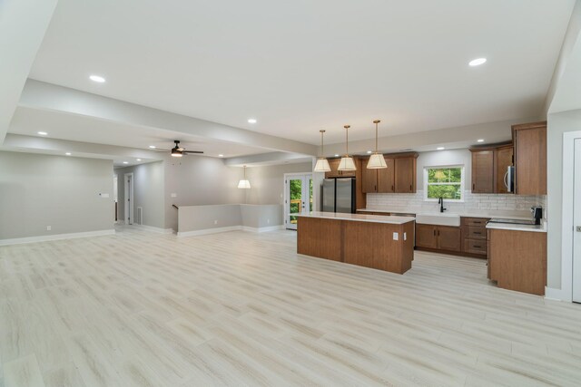 826 Long Mill Rd, Athens, TN 37303 - kitchen with stainless steel appliances, a sink, open floor plan, a kitchen island, and tasteful backsplash