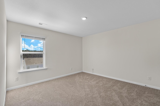 unfurnished room featuring carpet flooring