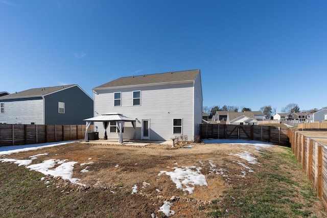 rear view of property featuring a patio, cooling unit, and a gazebo