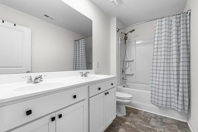 full bathroom with toilet, shower / bath combo with shower curtain, and vanity