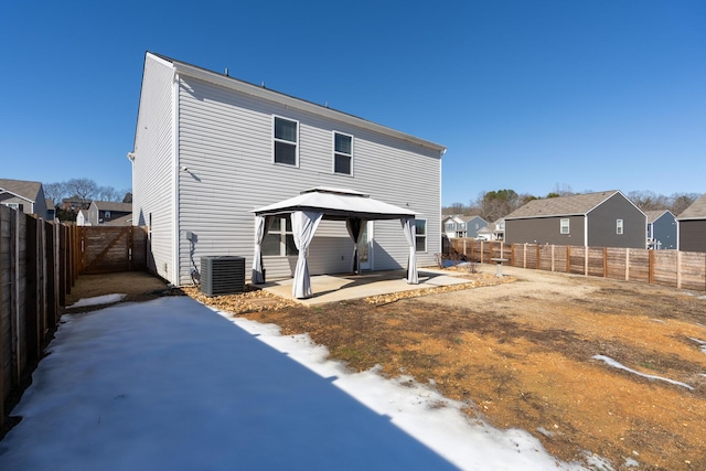 back of house featuring a gazebo, a patio area, and central AC