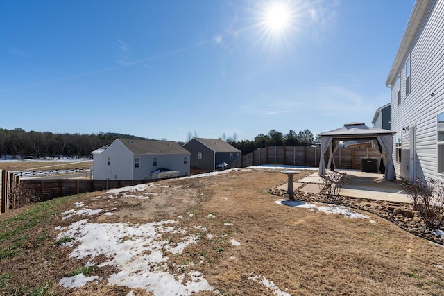 view of yard with central air condition unit and a gazebo