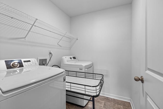 washroom with separate washer and dryer