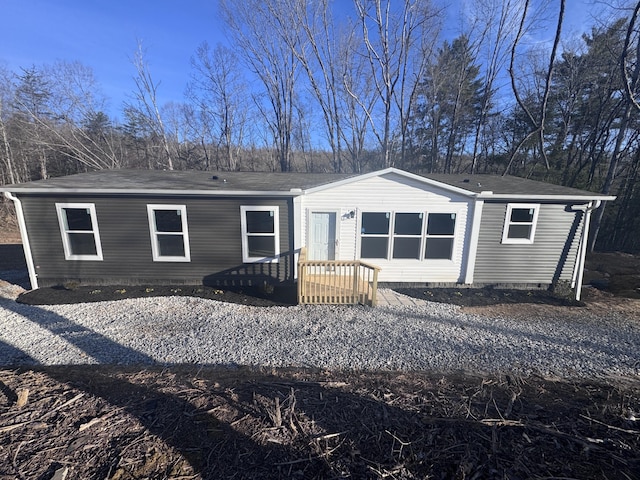 rear view of house with crawl space