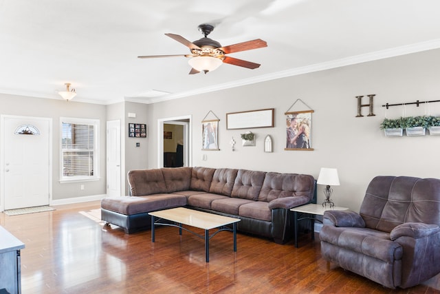 living room with ceiling fan, wood-type flooring, and ornamental molding