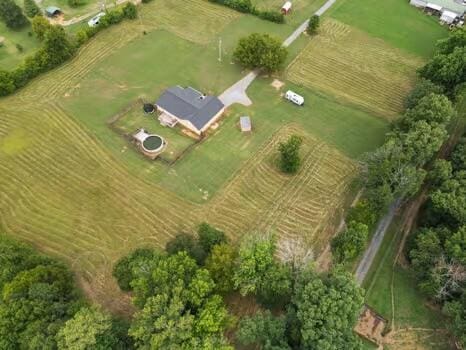 birds eye view of property with a rural view