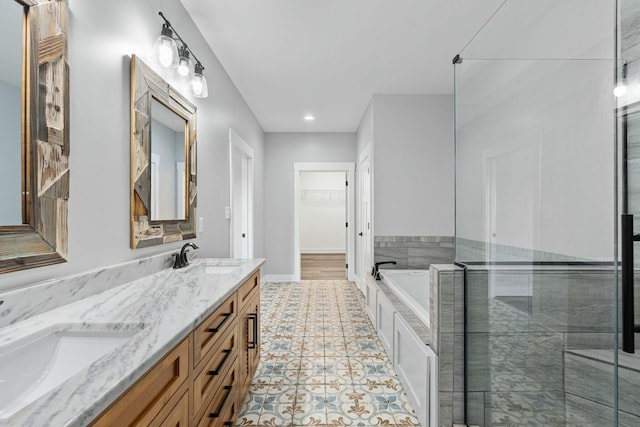 bathroom featuring vanity, tile patterned flooring, and plus walk in shower