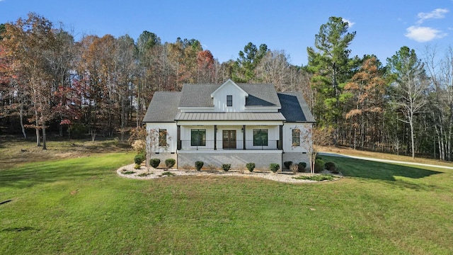 view of front of house featuring a front yard and a porch