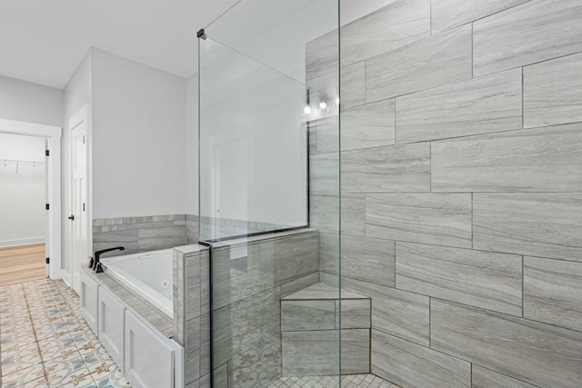 bathroom featuring separate shower and tub and tile patterned floors