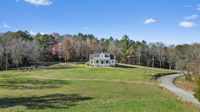 exterior space featuring a yard and a rural view