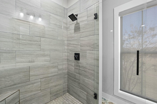 bathroom with a tile shower