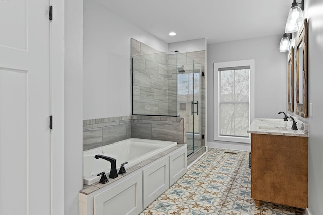 bathroom with tile patterned floors, vanity, and separate shower and tub