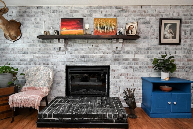 room details with hardwood / wood-style flooring and a fireplace