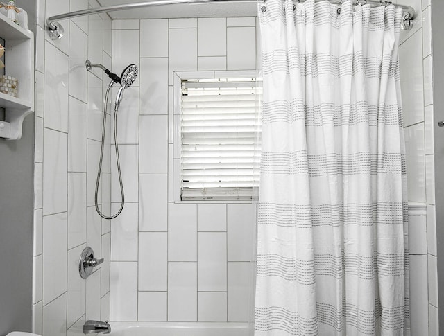 bathroom featuring shower / tub combo with curtain