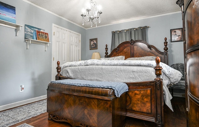 bedroom featuring crown molding, a closet, dark wood-type flooring, and a textured ceiling