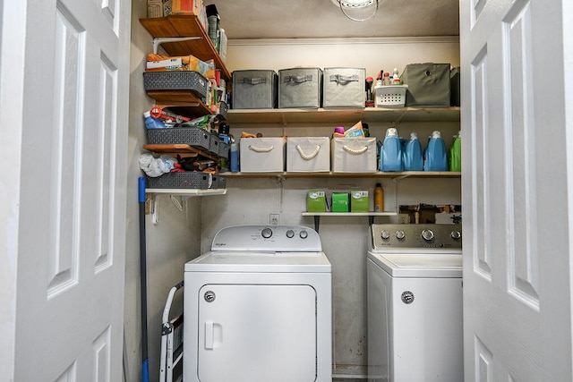 washroom with washer and dryer