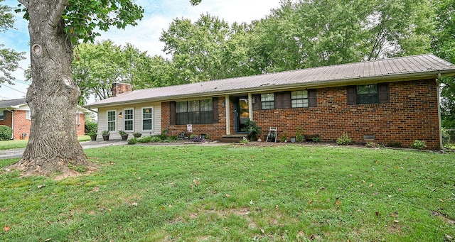 ranch-style home with a front yard