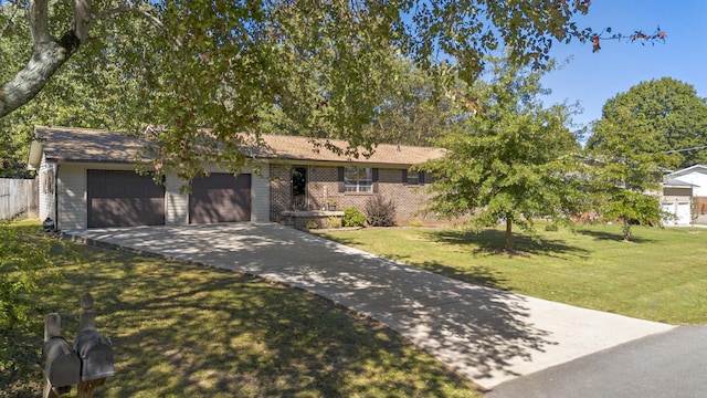 view of front of house with a front yard and a garage